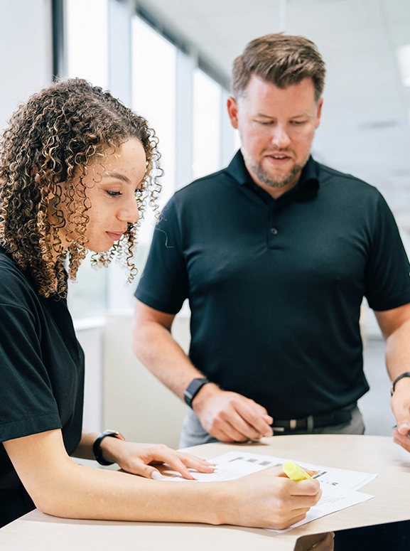 woman and man looking at forms for renting a vehicle in Atlanta